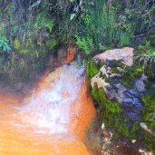 Orange thermal pools and waterfalls